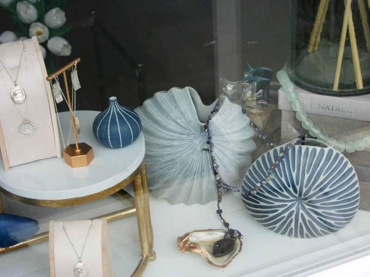 Jewelry showcased on shell shaped vases.