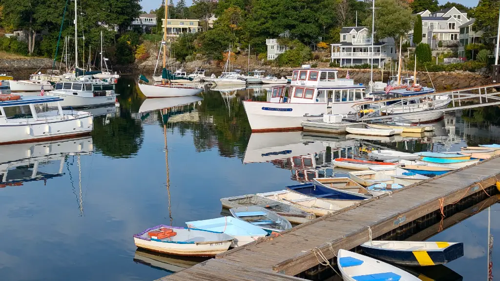 A view of Perkins Cove with several colorful boats floating.